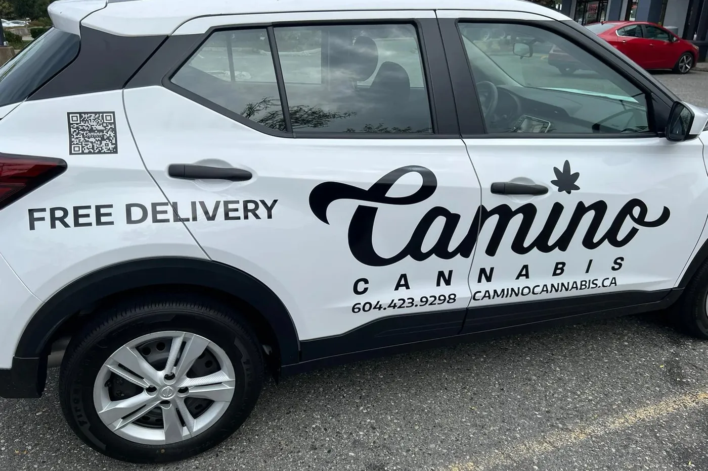 Camino Cannabis delivery car with Free Delivery signage, phone number 604.423.9298 and caminocannabis.ca